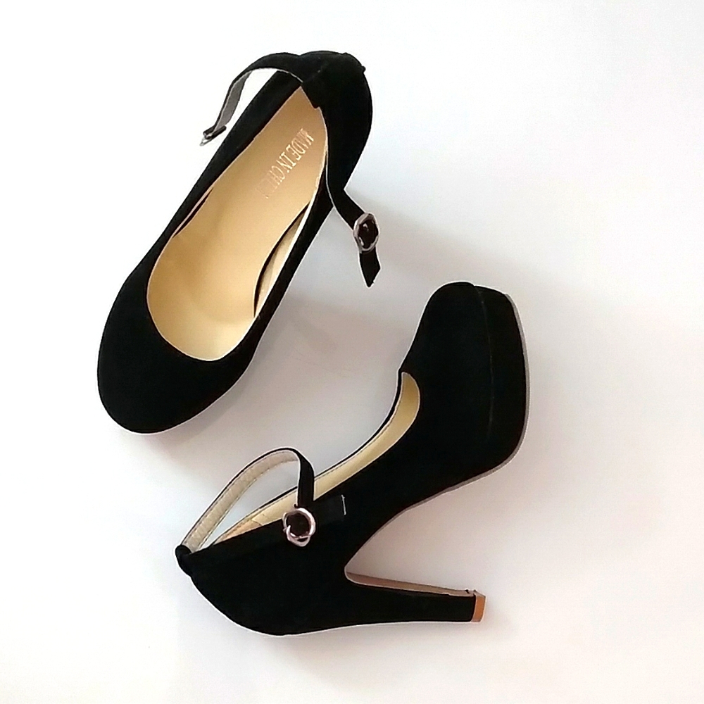 Black closed heels with a pretty ankle strap.